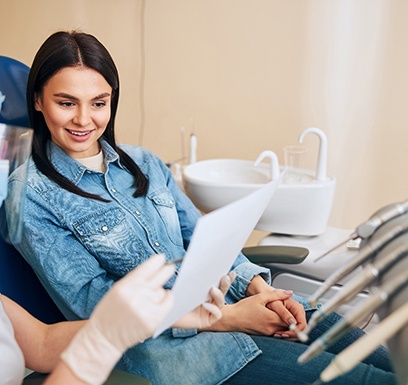 Patient talking to dental team member about treatment options